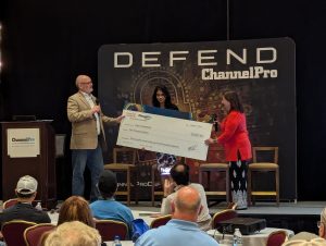 ChannelPro's Founder Michael Siggins, Scholarship Winner Kavya Venkatesan, and CompTIA's  MSP cybersecurity